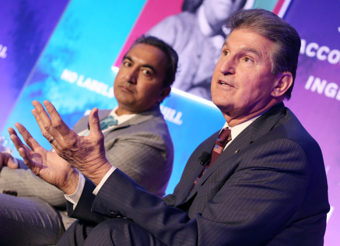 CONGRESSIONAL PROGNOSTICATION -- Sen. Joe Manchin, D-W.Va, right, and Rep. Ami Bera, D-Calif., talk about where President-elect Trump does and does not need Congress -- and where the toss-ups are at a panel discussion at the